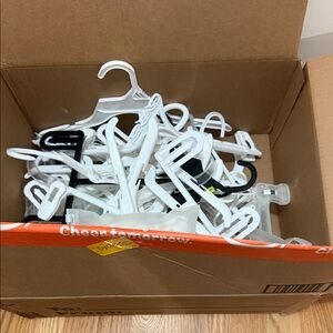 Box of 32 White set Hangers and 45 hanger hooks